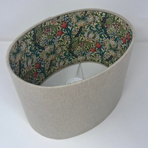 Handmade oval lampshade with natural linen exterior and William Morris Golden Lily floral fabric lining