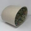 Handmade oval lampshade with natural linen exterior and William Morris Golden Lily floral fabric lining