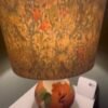 Handmade oval lampshade with natural linen exterior and William Morris Golden Lily floral fabric lining