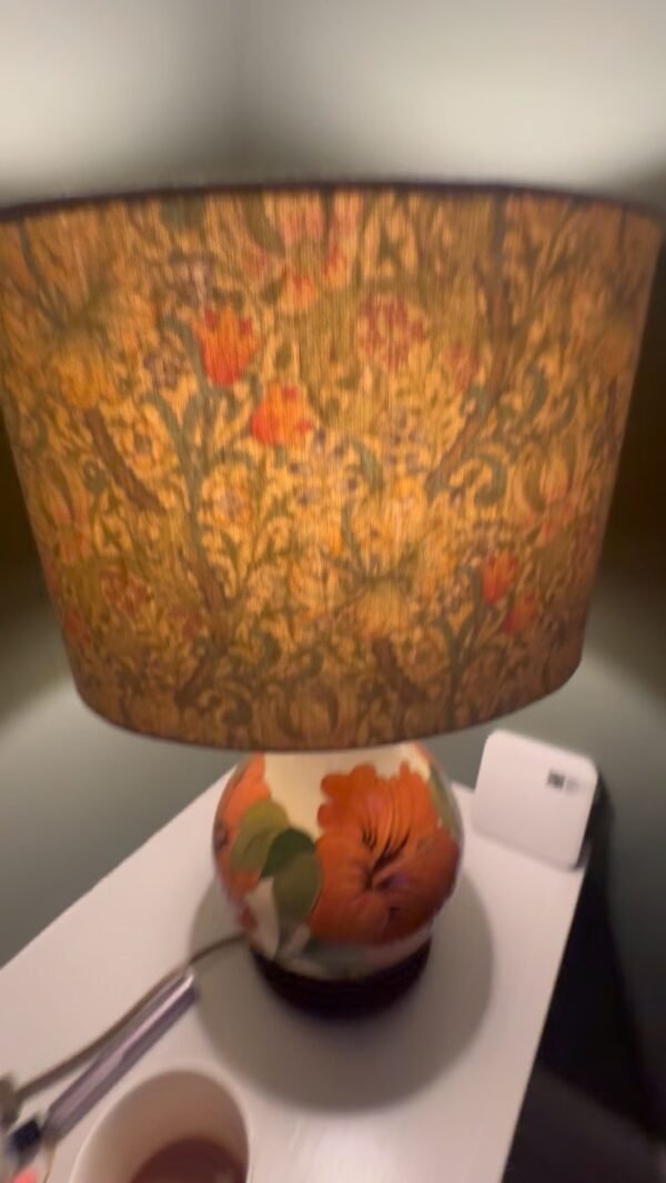 Handmade oval lampshade with natural linen exterior and William Morris Golden Lily floral fabric lining