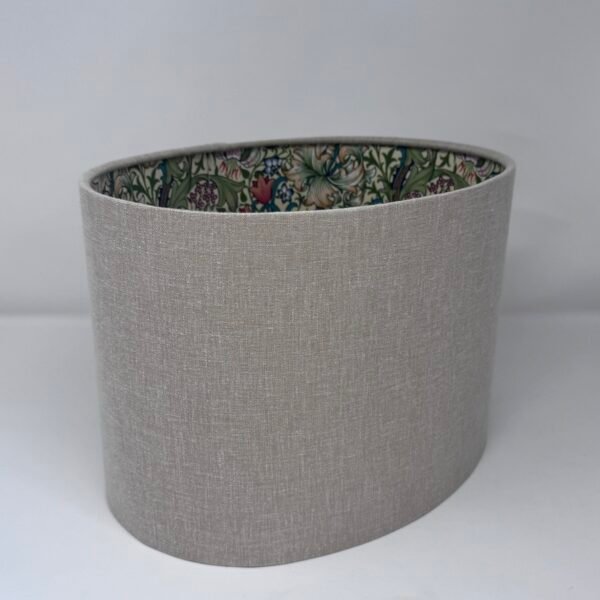 Handmade oval lampshade with natural linen exterior and William Morris Golden Lily floral fabric lining