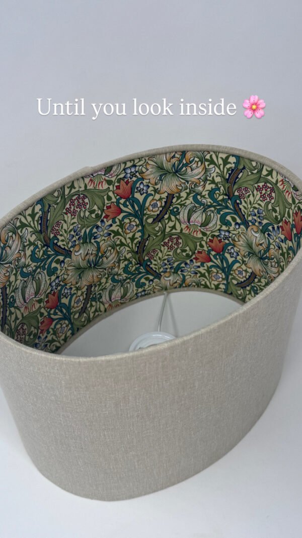 Handmade oval lampshade with natural linen exterior and William Morris Golden Lily floral fabric lining