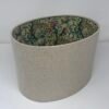Handmade oval lampshade with natural linen exterior and William Morris Golden Lily floral fabric lining