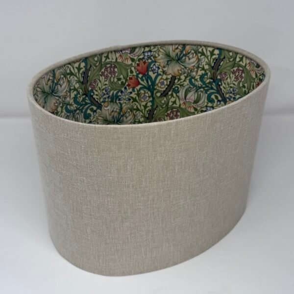 Handmade oval lampshade with natural linen exterior and William Morris Golden Lily floral fabric lining